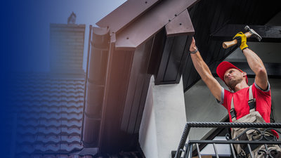 Roofing Contractor working on House